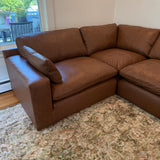 Ashley Furniture Atlas Reserve corner sectional with four sections, featuring plush cushions and stylish fabric upholstery.