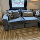Fusion Barrington 4-piece corner sectional sofa with beige upholstery and plush cushions, arranged in a spacious living room setting.