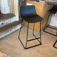 Black MCM indoor/outdoor counter height barstool by Article with a sleek, modern design and sturdy metal frame.