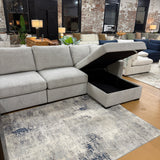 Ashley Furniture Haven 5-piece modular sectional with chaise showing plush fabric and contemporary design in a living room setting.