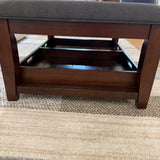 Pull Up A Couch Roseville ottoman coffee table with wooden legs and a round top, ideal for living room decor.