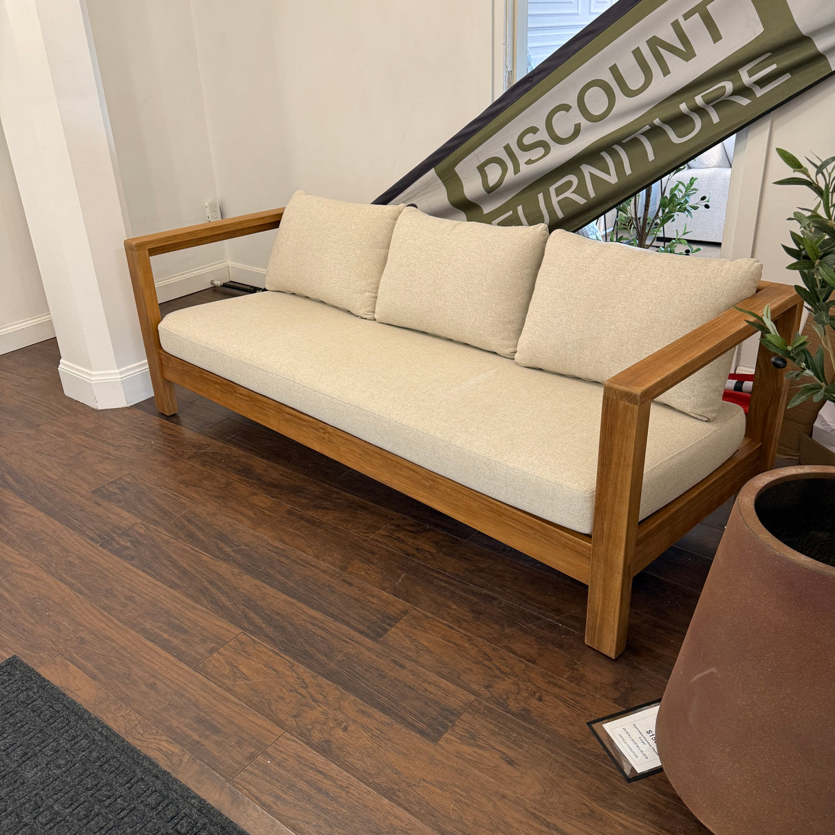 Outdoor sofa in Portside beige by Article, featuring plush cushions and a modern design for outdoor seating and relaxation.