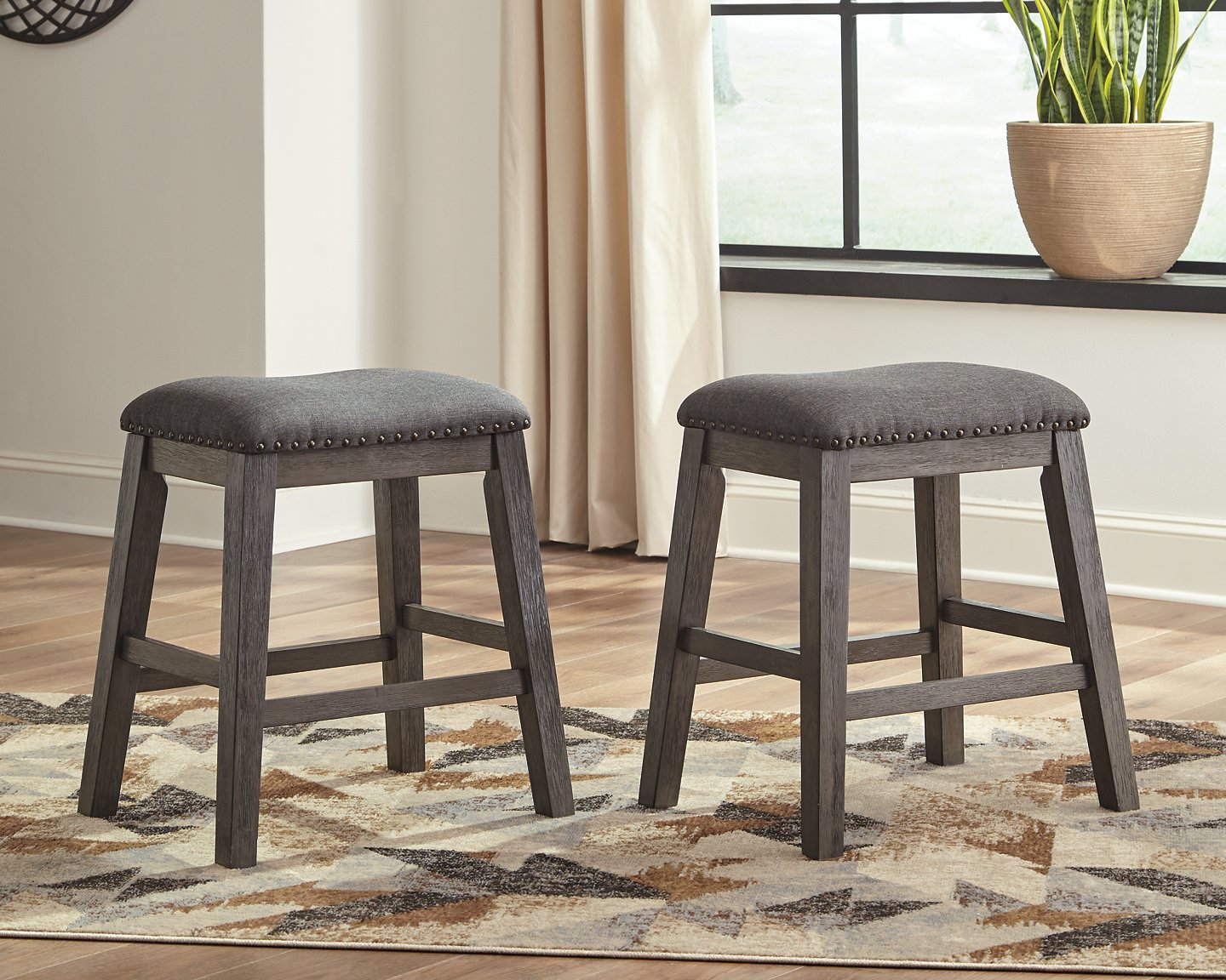 Caitbrook Counter Height Upholstered Bar Stool - Pull Up A Couch