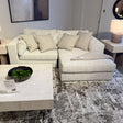 Ashley Furniture Alpine 2-piece sectional with chaise, featuring plush upholstery and modern design in a cozy living room setting.