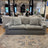 Ashley Furniture Nova Cloud 2-piece modular sofa with plush cushions and contemporary design, shown in a spacious living room setting.