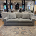 Ashley Furniture Nova Cloud 2-piece modular sofa with plush cushions and contemporary design, shown in a spacious living room setting.