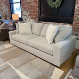 Ashley Furniture Hudson Sofa with plush cushions and contemporary design, shown in a stylish living room setting.