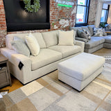 Ashley Furniture Hudson Sofa showing plush cushions and neutral fabric upholstery in a modern living room setting.