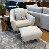 Ivory Bouclé lounge chair with matching ottoman by Article, featuring soft fabric upholstery and modern design.