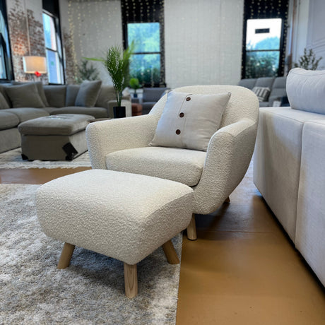 Ivory Bouclé Lounge Chair with Ottoman by Article, showcasing plush fabric and modern design in a cozy living space.