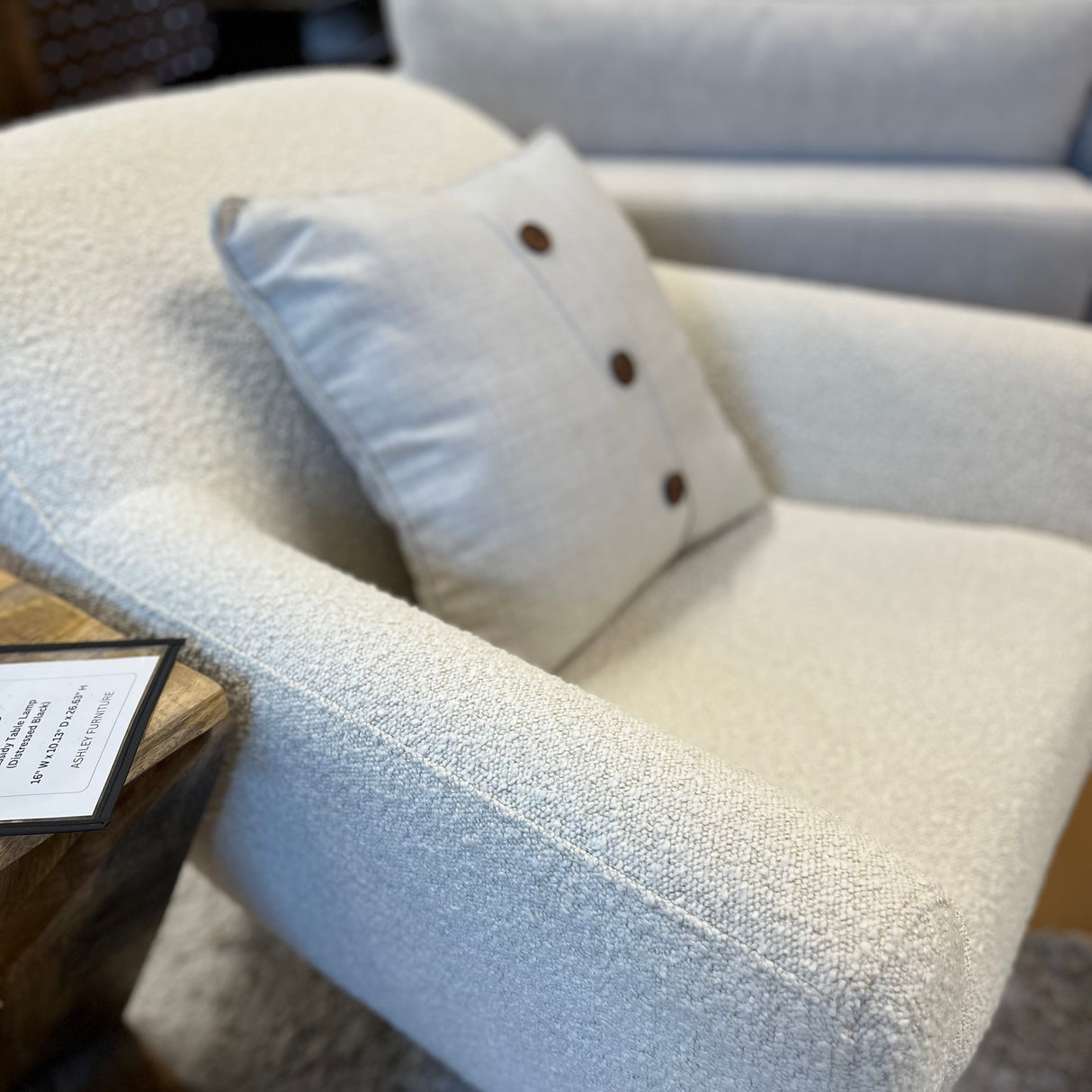 Ivory bouclé lounge chair with matching ottoman by Article, featuring plush fabric and modern design for comfortable relaxation.