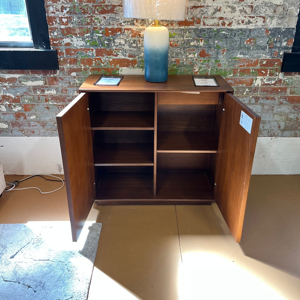 Article 37-inch walnut MCM cabinet with storage, featuring sleek mid-century modern design and clean lines.