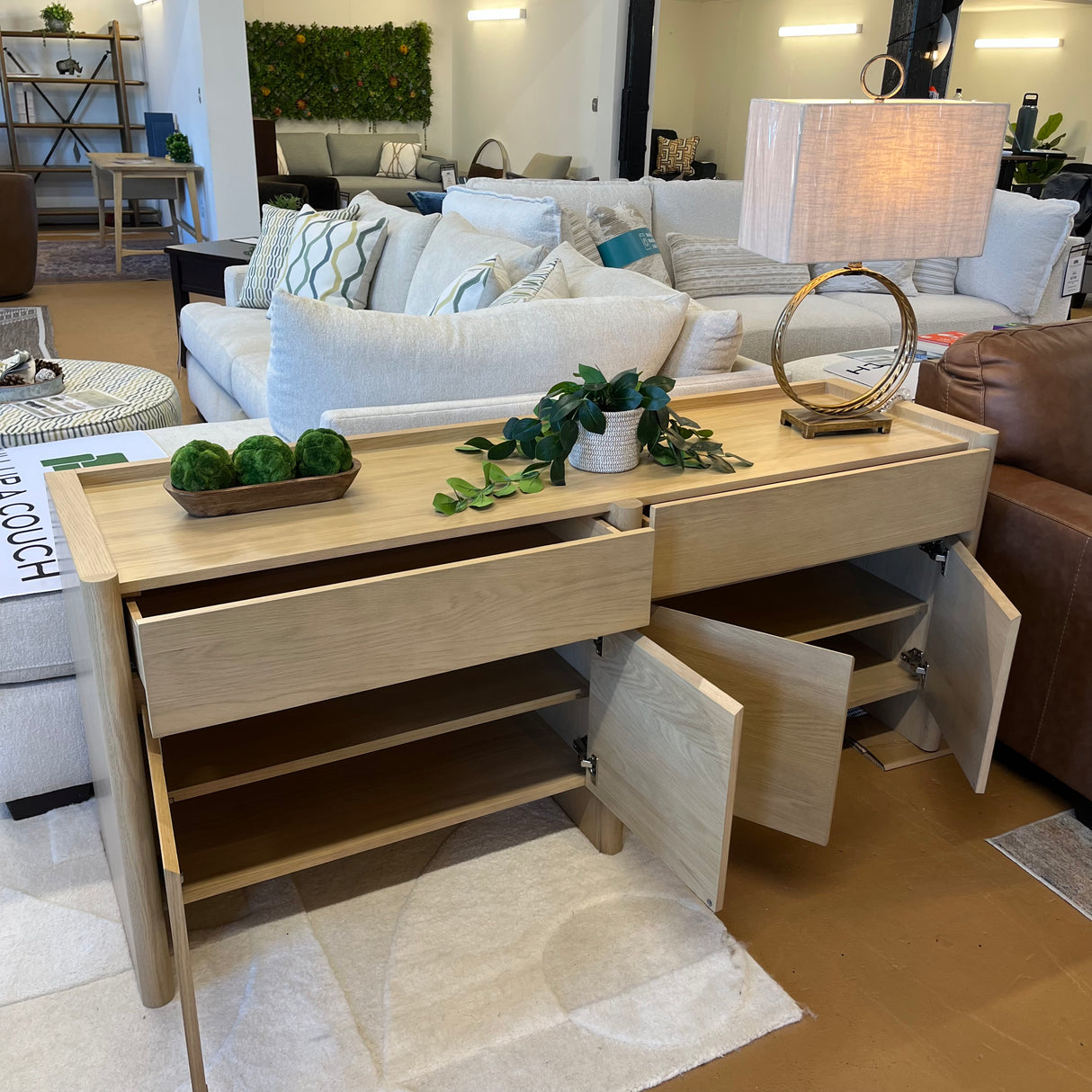 White oak 70-inch MCM-style sideboard by Article featuring sleek modern design and spacious storage.