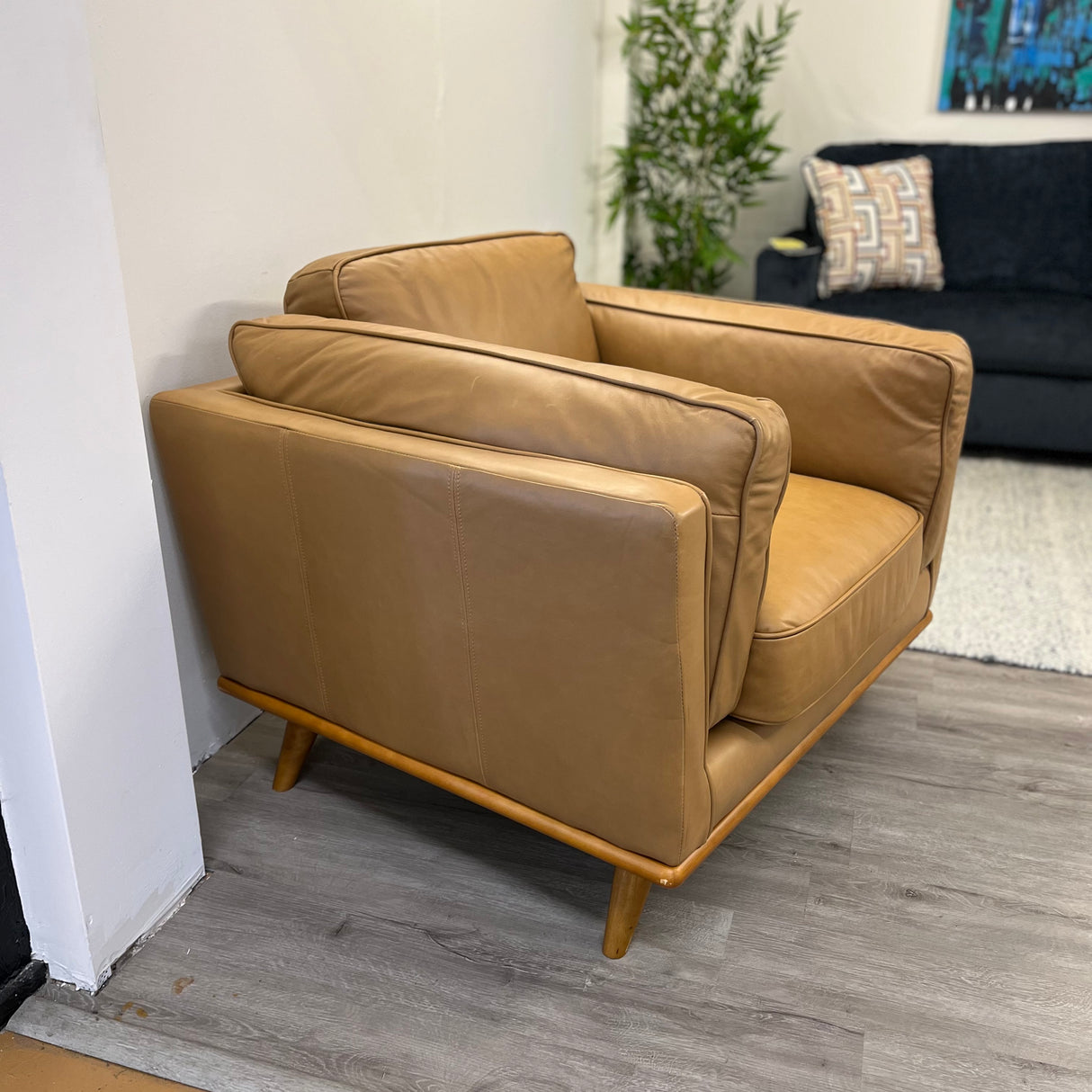MCM Lounge Chair in Charme Tan leather by Article, featuring a sleek modern design with plush cushioning and stylish armrests.