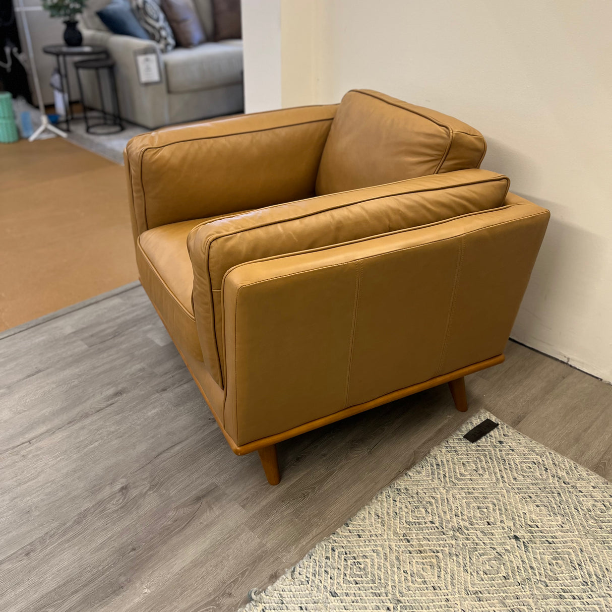 Leather MCM Lounge Chair by Article in Charme Tan leather with sleek, modern design and wooden legs.