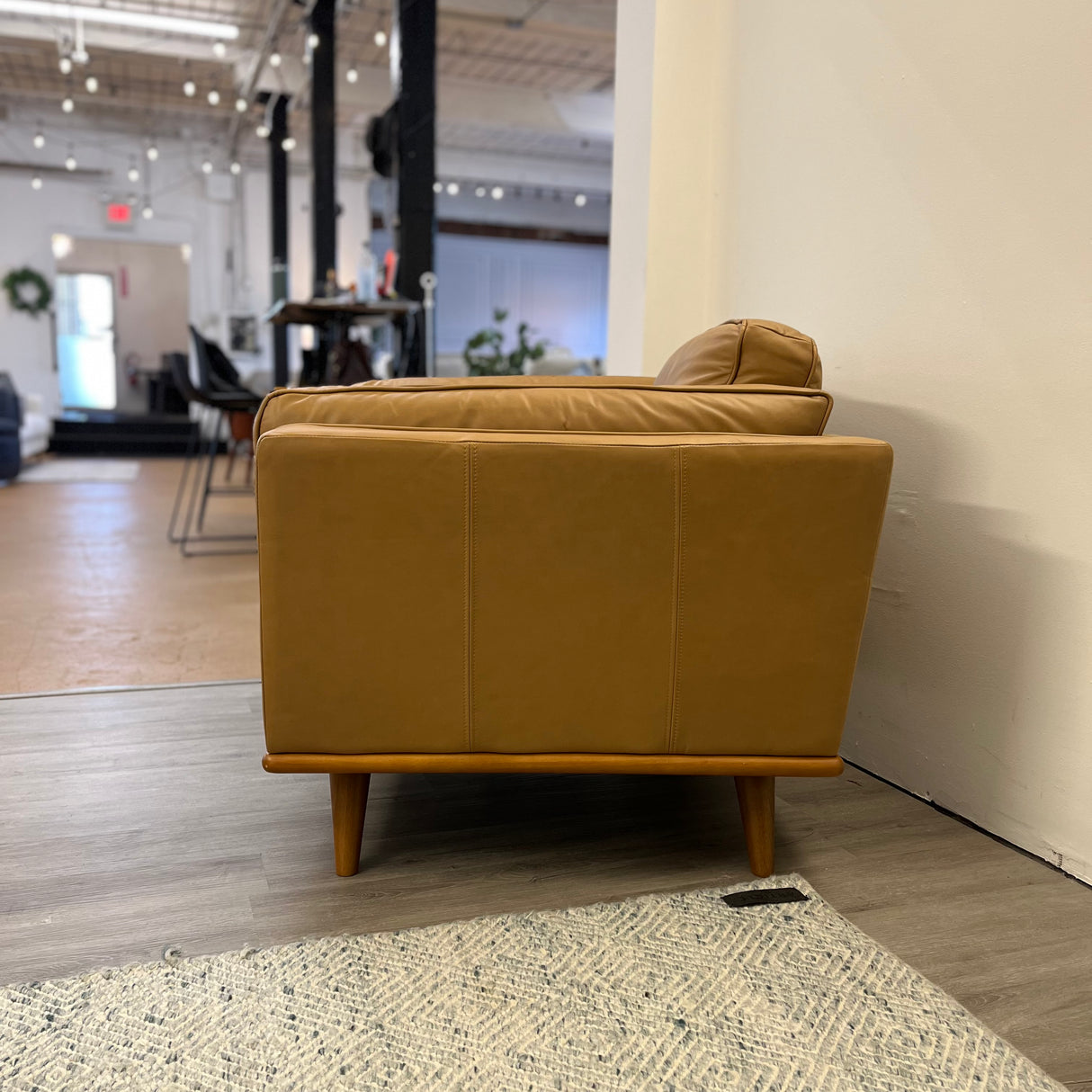 Leather MCM Lounge Chair by Article in Charme Tan, showing its sleek design and smooth leather upholstery.