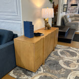 Natural oak MCM-style 66-inch sideboard by Article with sleek design and wood grain finish, ideal for modern living spaces.