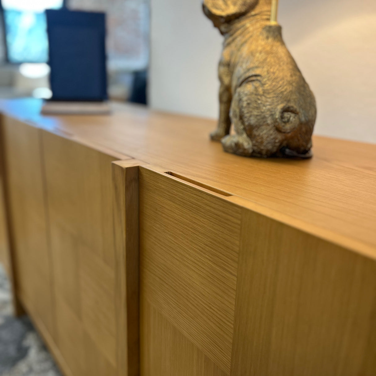 Natural oak MCM-style sideboard measuring 66 inches, sleek design with clean lines, modern storage solution from Article.