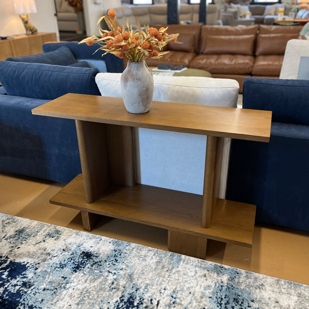 Smoked oak 48-inch MCM console table by Article with sleek modern design and tapered legs, perfect for entryways or living rooms.