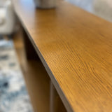 Smoked oak 48-inch MCM console table by Article with sleek, mid-century modern design and smooth wooden finish.