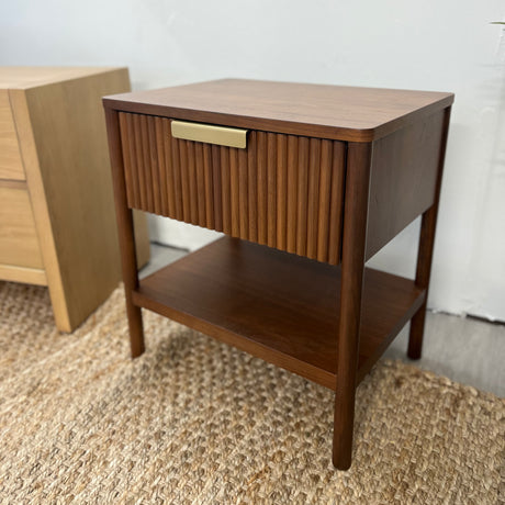 Wooden walnut nightstand with storage drawers from Article, featuring a sleek, modern design suitable for bedroom decor.