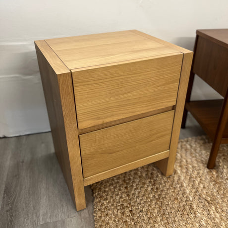White oak 2-drawer MCM nightstand by Article with sleek modern design and minimalist hardware, perfect for bedroom decor.