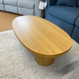 Oak 46-inch MCM-style coffee table by Article featuring a sleek, modern design with a smooth finish and sturdy wooden legs.