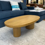 Oak MCM-style coffee table, 46-inch Article brand piece with mid-century modern design and sleek wooden finish.