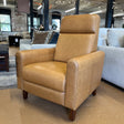 MCM Recliner Chair in Taos Tan leather with plush cushioning and wooden legs, designed for comfortable seating.