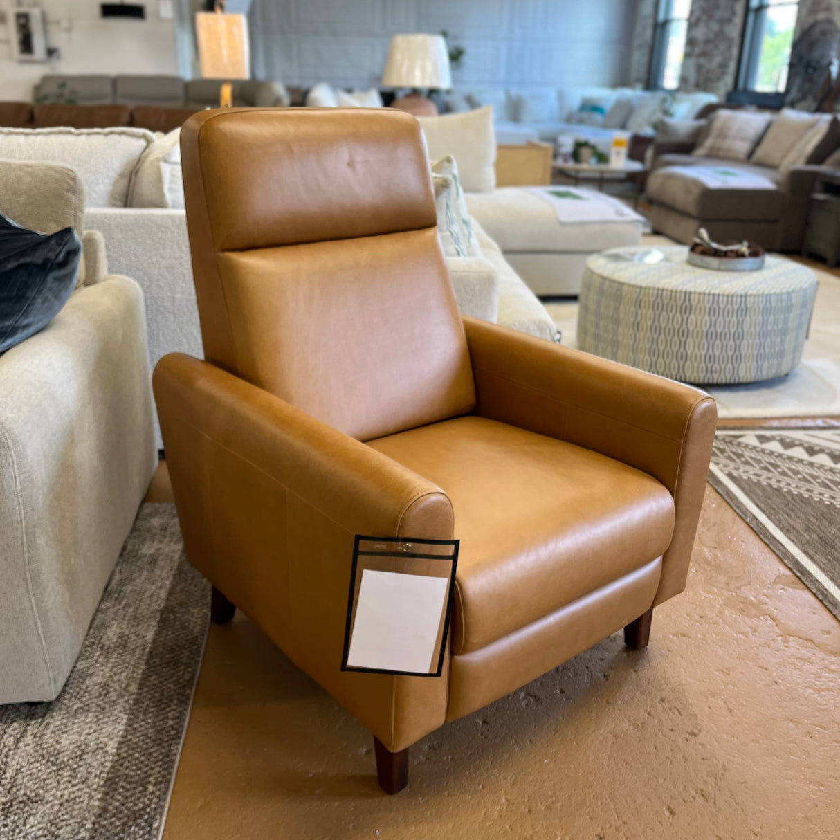 MCM Recliner Chair in Taos Tan Leather by Article, showcasing plush cushioning and stylish design in a modern living room setting.