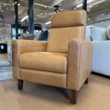 Article MCM recliner chair in Taos tan leather with plush cushioning and modern design, showcasing a comfortable seating option.