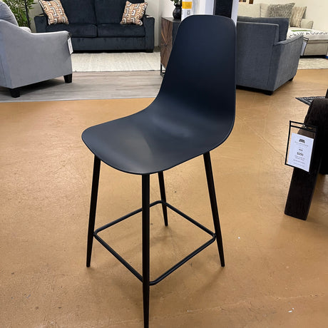 Black MCM barstool by Article with a sleek counter height design, featuring a modern minimalist style and sturdy wooden legs.