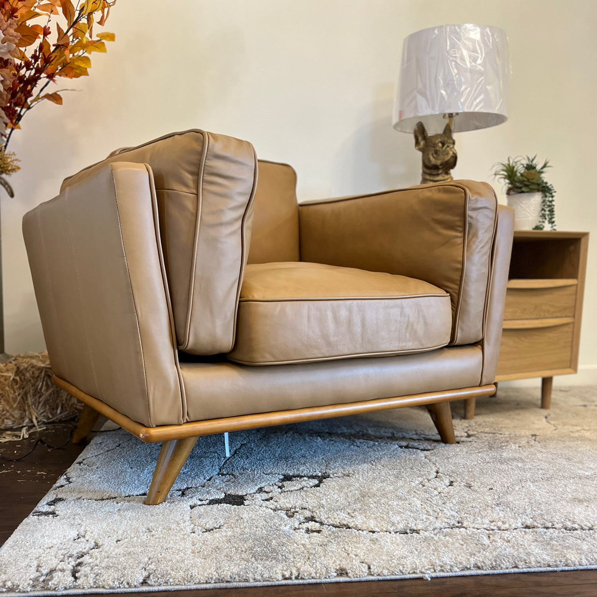 Leather MCM lounge chair in Charme Tan by Article, featuring a sleek, modern design with plush cushioning and tapered wooden legs.