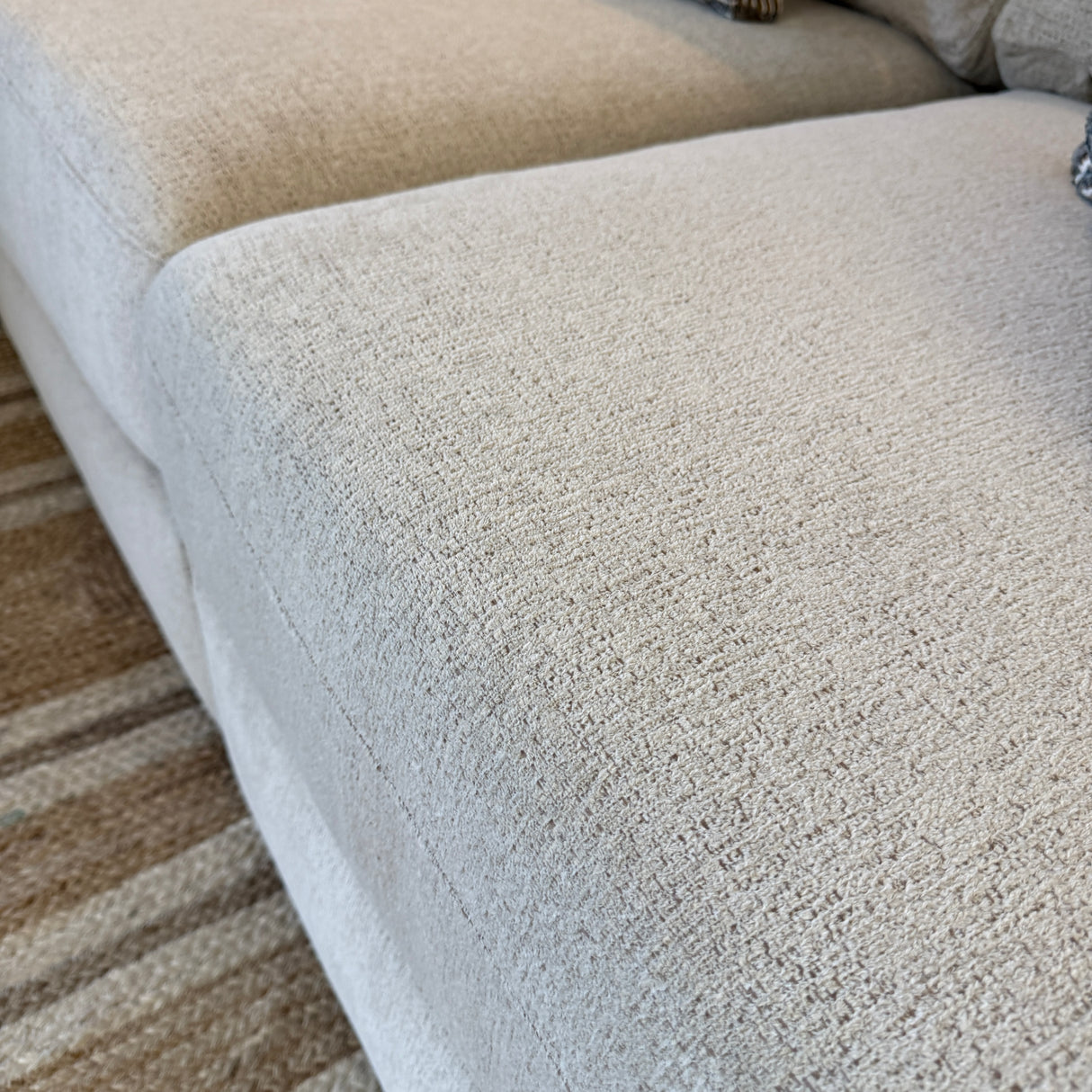 Behold Home Sequoia Accent Ottoman with plush fabric, round shape, and wooden legs, ideal for living room decor.