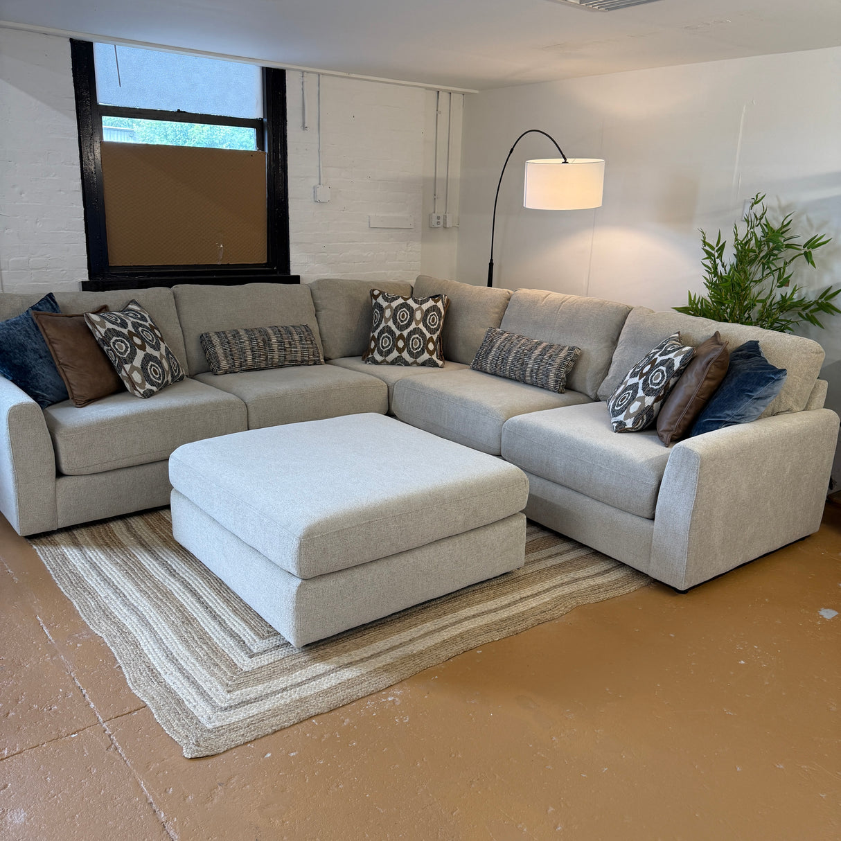 Behold Home Sequoia Accent Ottoman with plush fabric and wooden legs, perfect for living room or bedroom decor.