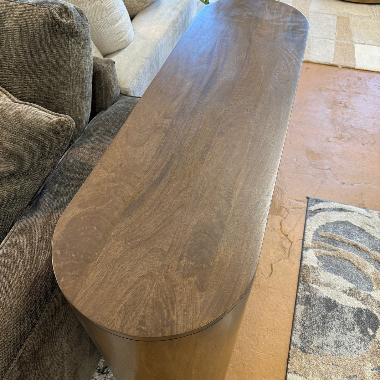 Pull Up A Couch Hayes sofa table with a sleek wooden surface and metal legs, ideal for living room decor and convenience.