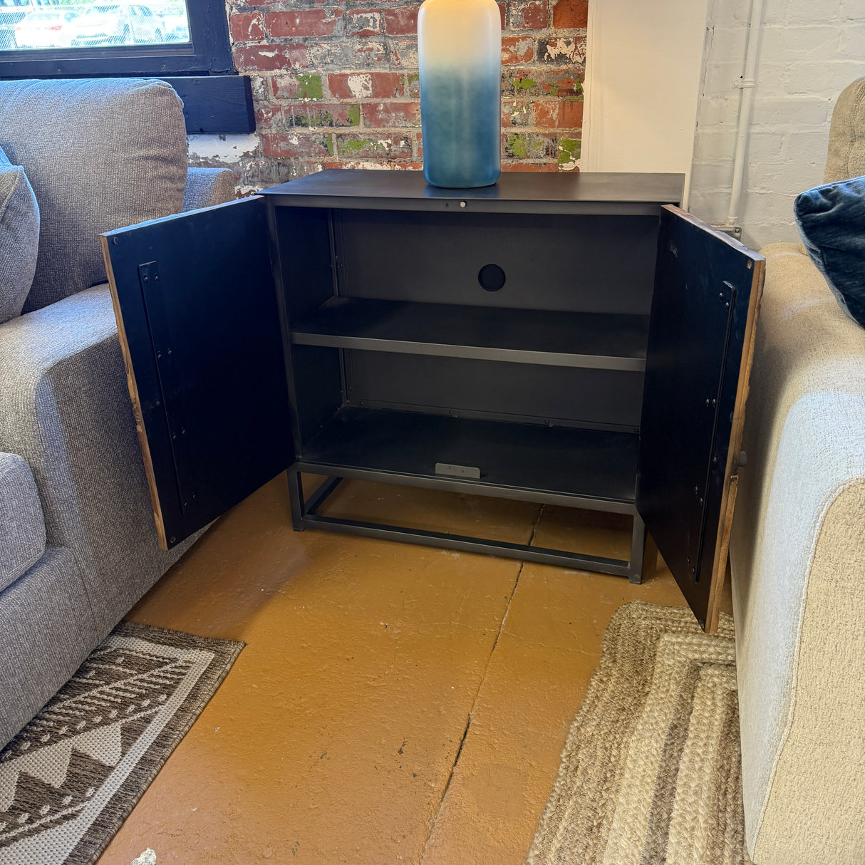 Pull Up A Couch Cedarville Accent Cabinet with wood finish, featuring storage doors and decorative hardware.