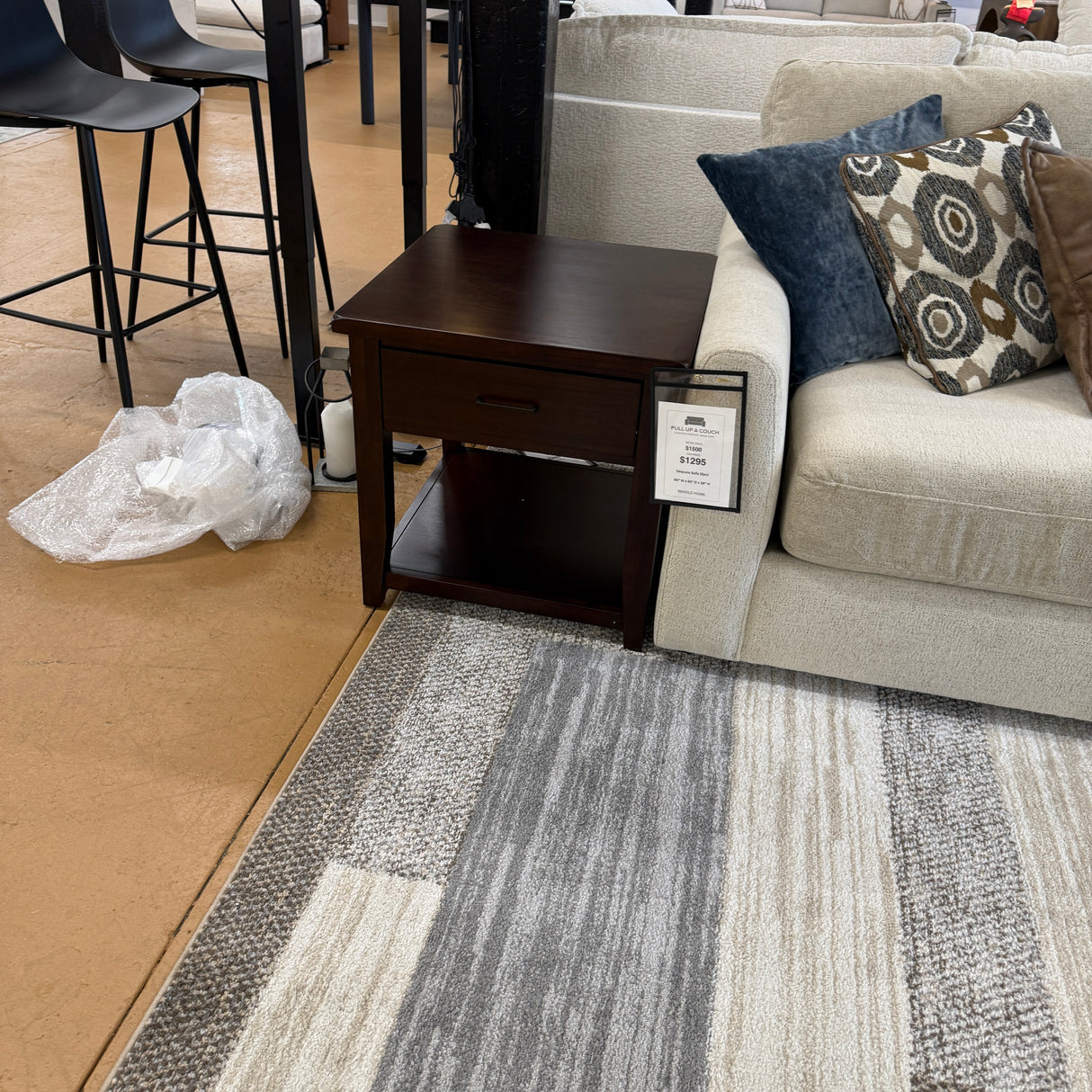 Pull Up A Couch Roseville End Table with wood finish, featuring a simple rectangular design and sturdy construction.