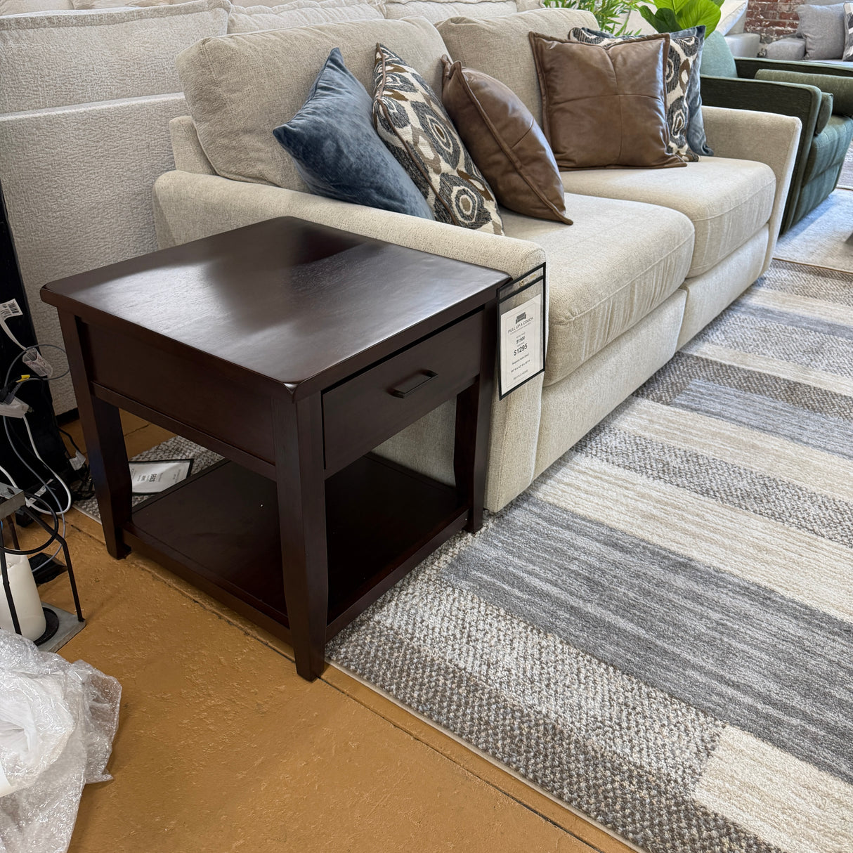 Pull Up A Couch Roseville End Table featuring a wooden surface and tapered legs, ideal for living room or bedroom decor.