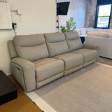 Ashley Furniture Salerno power reclining sofa, a three-piece sectional in neutral fabric with plush cushions and reclining features.