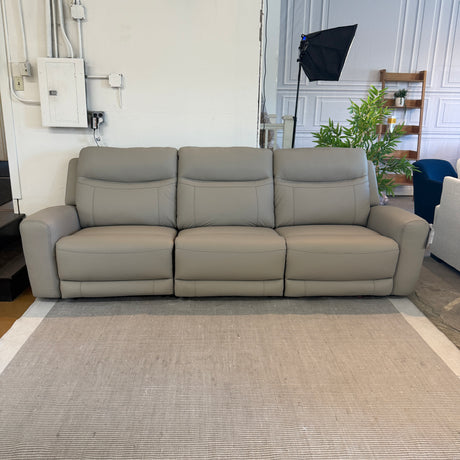 Ashley Furniture Salerno Power Reclining Sofa, a three-piece sectional sofa with plush cushions and reclining features, in a modern design.
