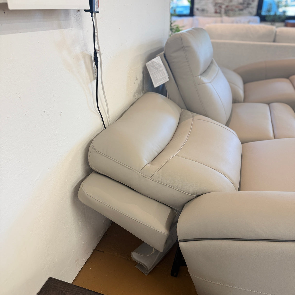 Ashley Furniture Salerno Power Reclining Sofa, a three-piece sectional with plush cushions and reclining features, shown in a modern living room.