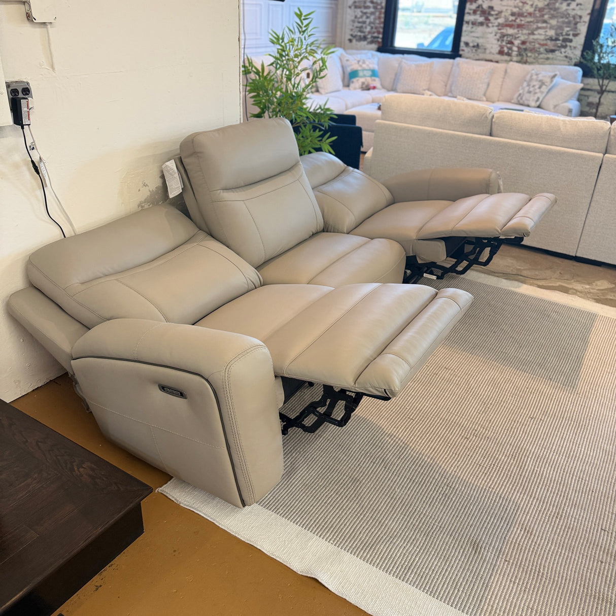 Ashley Furniture Salerno Power Reclining Sofa, a 3-piece sectional with plush fabric and reclining features, shown in a modern living room setting.