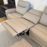 Ashley Furniture Salerno Power Reclining Sofa, a three-piece sectional with plush cushions and reclining features, shown in a modern living room.