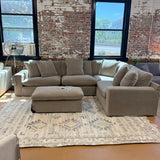 Ashley Furniture Nova Cloud 4-piece sectional with plush cushions and modern design, shown in a spacious living room setting.
