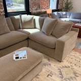 Ashley Furniture Nova Cloud 4-piece corner sectional showing plush cushions and modern design in a living room setting.