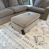 Ashley Furniture Nova Cloud 4-piece corner sectional with plush fabric, featuring multiple seating sections and a modern design.