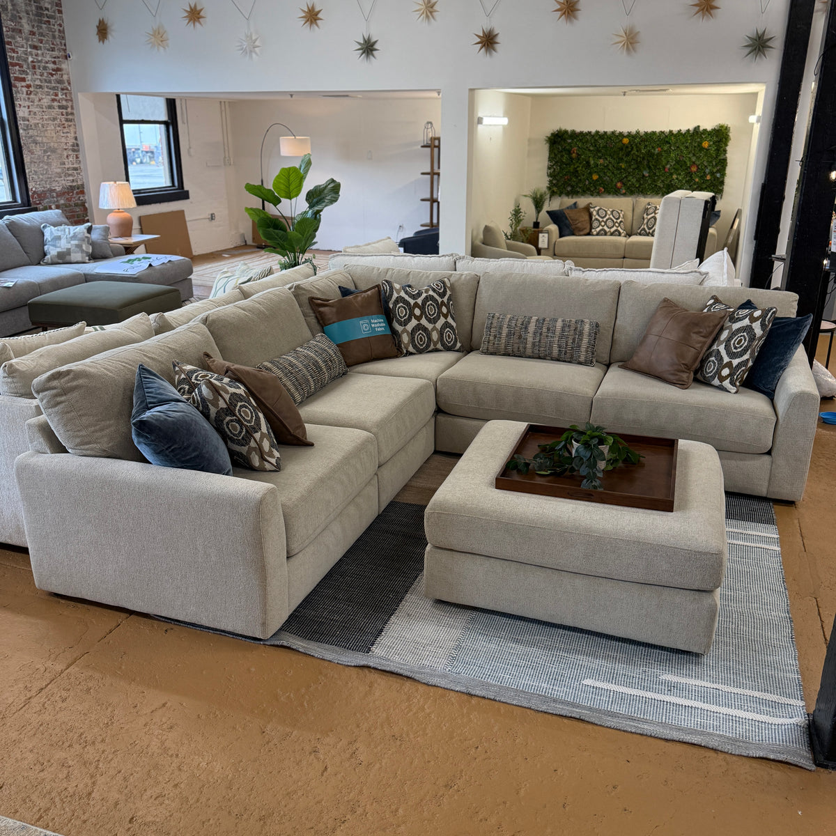 Behold Home Sequoia Accent Ottoman in neutral fabric with wooden legs, suitable as a stylish footstool or side accent piece.
