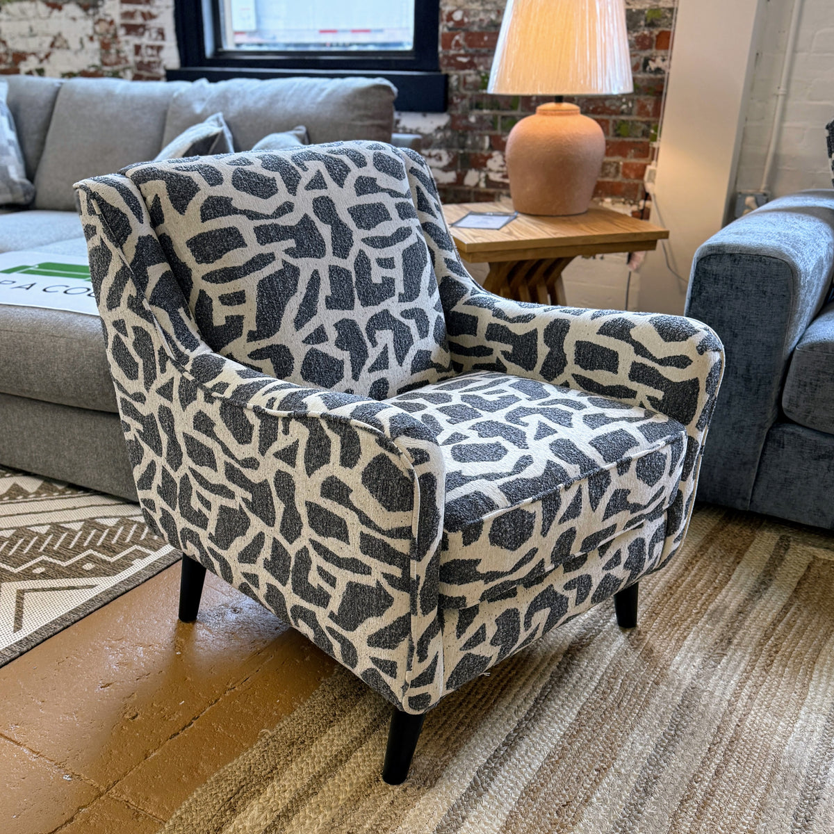 Fusion Barrington Accent Chair with plush fabric upholstery and wooden legs, showcasing a stylish and comfortable design.