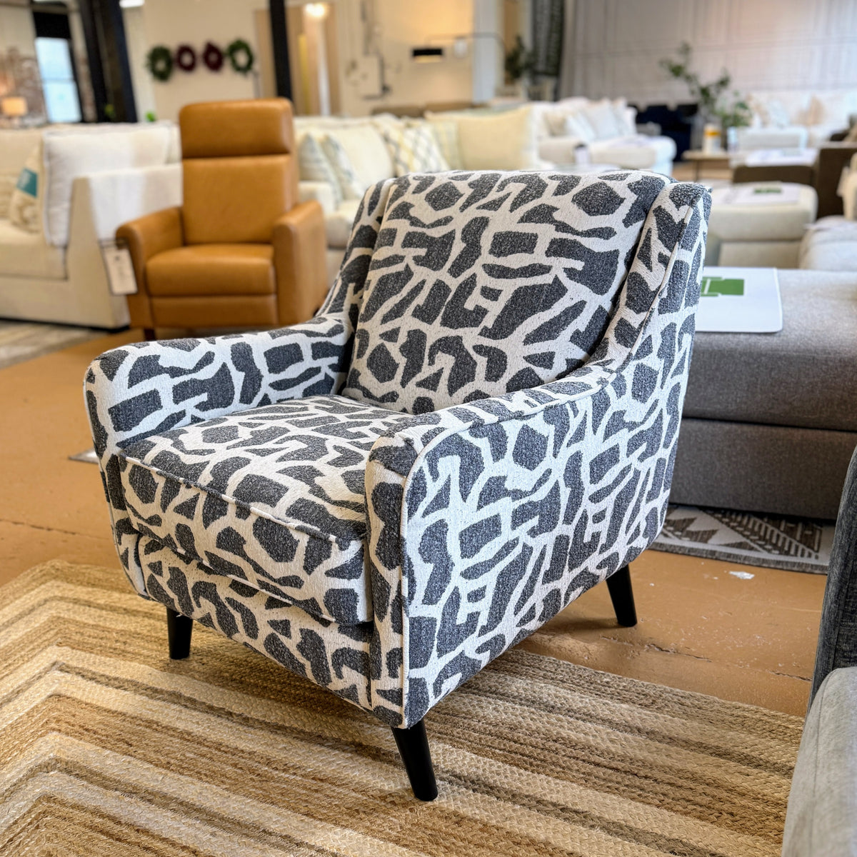 Fusion Barrington accent chair with plush fabric upholstery and wooden legs, showcasing a stylish and comfortable seating option.
